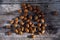 Bunch of almonds unshelled, badam, forest fruit harvest on wood