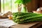 bunch of asparagus stalks on a kitchen table