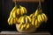 bunch of bananas hanging from a holder