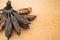 Bunch of black overripe bananas on a wooden background