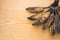 Bunch of black overripe bananas on a wooden background