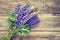 Bunch of blue lupine flowers on wooden background