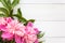 Bunch, bouquet of pink peonies on a wooden background. Frame of flowers