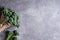 Bunch of broccolini on grey stone background