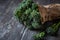 Bunch of broccolini on wooden table.