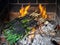 Bunch of calcots typical winter scallion or green onions from Catalonia being cooked in a barbecue