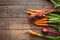 A bunch of carrots and beetroots . Fresh carrots, beetroot  heap with green stems. Raw Carrots and beetroot on rustic  wooden back