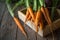 A bunch of carrots . Fresh carrots, beetroot  heap with green stems. Raw Carrots and beetroot on rustic  wooden back