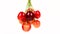 A bunch of cherries rotate clockwise. Fresh juicy sweet cherry rotate. Sweet-cherry texture. Side view.