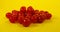 A bunch of cherry sweets on a yellow background