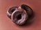 Bunch of chocolate doughnuts on a brown background