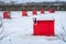 Bunch of colourfull Ice Fishing cabins in a vast spaces on the frozen river