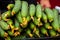 A bunch of cucumbers are for sale in the local market