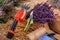 .A bunch of cut lavender in a wicker basket and pruning shear against a backdrop of flowering lavender fields. Lavander Harvesting