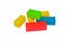 Bunch of different color building blocks gathered together before a white background