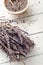 Bunch of Dried Lavender with Buds Filling Bowl and Scattered on Table