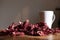 A bunch of dried red hibiscus karkade flowers and white tea cup
