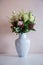 Bunch of elegant flowers in vase as love or Valentines day attribute