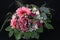 A bunch of flowers with Gerberas, roses and hydrangeas on black background