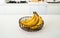 A bunch of fresh banana in a modern kitchen