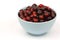 Bunch of fresh cranberries in a blue bowl