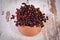 Bunch of fresh elderberry on old wooden background, healthy food