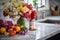 a bunch of fresh flowers on a marble countertop in a well-equipped kitchen