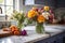 a bunch of fresh flowers on a marble countertop in a well-equipped kitchen