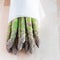 Bunch of fresh green asparagus on wooden table, square format