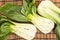 Bunch of fresh green baby bok choy , on bamboo placemat