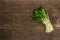 Bunch of fresh harvest of spring ramson, wild leek. Fragrant spicy leaves on vintage wooden table