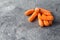 Bunch of fresh healthy carrots vitamins on a light gray background