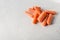 Bunch of fresh healthy carrots vitamins on a light gray background