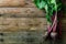 Bunch of fresh organic beetroot on wooden background. Concept of diet, raw, vegetarian meal. Farm, rustic and country