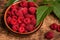 Bunch of fresh raspberries in a bowl