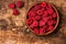 Bunch of fresh raspberries in a bowl