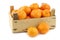 Bunch of fresh tangerines in a wooden box