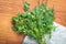 Bunch of fresh young onions, dill, parsley on the wooden table top view