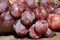 Bunch of grapes on a wooden table an old, country house