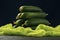 A bunch of green ripe cucumber fruits on the dark background. Vegetable pyramid composition on table