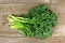 Bunch of kale over a wooden background