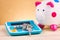 Bunch of key, calculator and white piggy bank for financial and saving concept