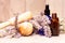 Bunch lavender mortar and pestle and bottles of essential oils for aromatherapy