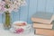 Bunch of lilac, books and teacup