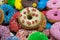Bunch of multicolor donuts closeup