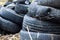 A bunch of old tires from used cars