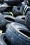 A bunch of old tires from used cars