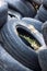 A bunch of old tires from used cars