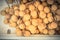 Bunch of organic longan in Styrofoam box at street market stall in Little India, Singapore