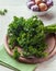 Bunch of parsley on wooden chopping board